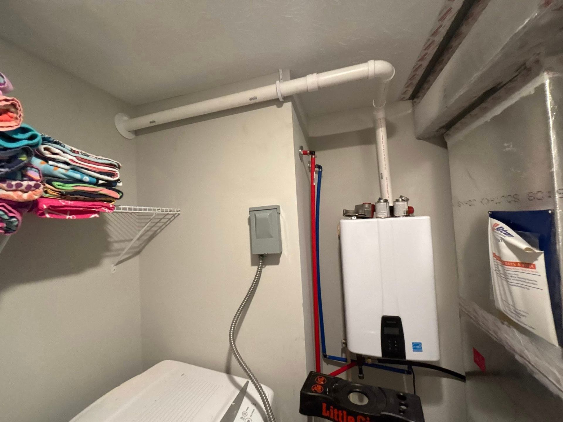 Modern tankless water heater installed in an Anderson home