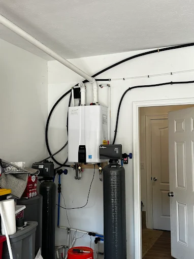 Tankless water heater and water softener installed by Golden Plumbing
